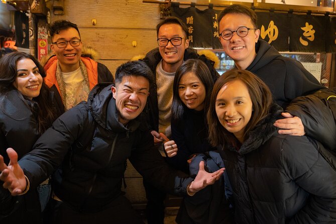 Osaka Local Bar Crawl in Dotombori & Uranamba Area - Meet at Dotonbori Humanity Song Monument, then learn the Glico sign meaning
